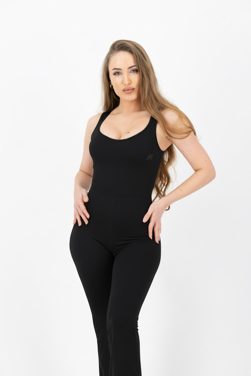 Woman wearing a black bodysuit on a white background